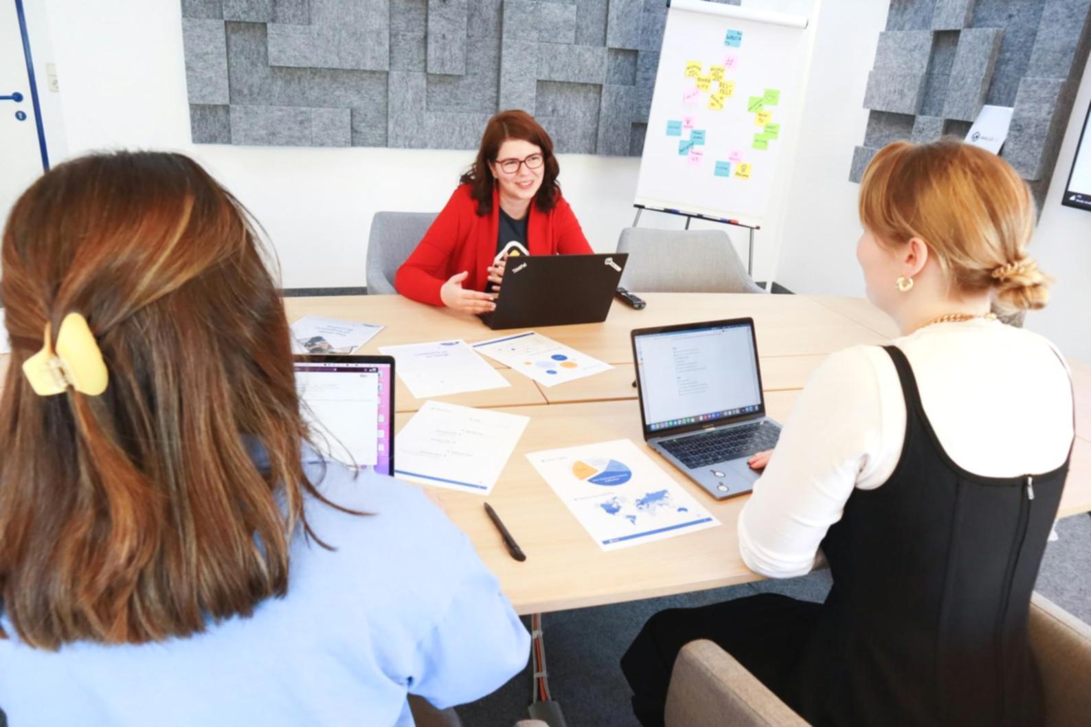 Team analyzing campaign performance data and optimization strategies